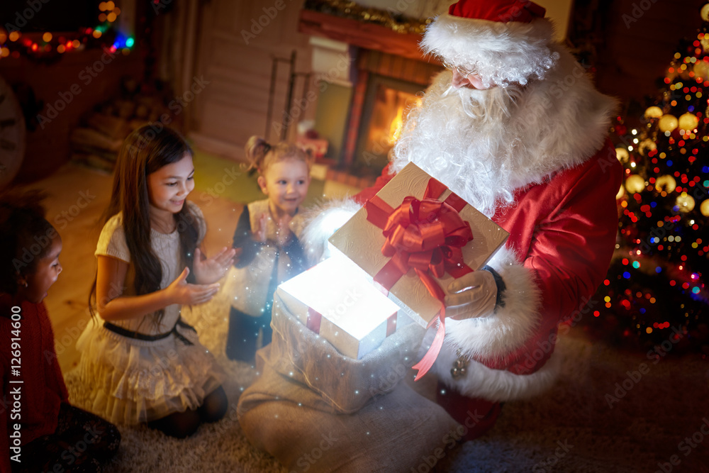 Surprised children with magical Christmas gift Surprised children with magical Christmas gift