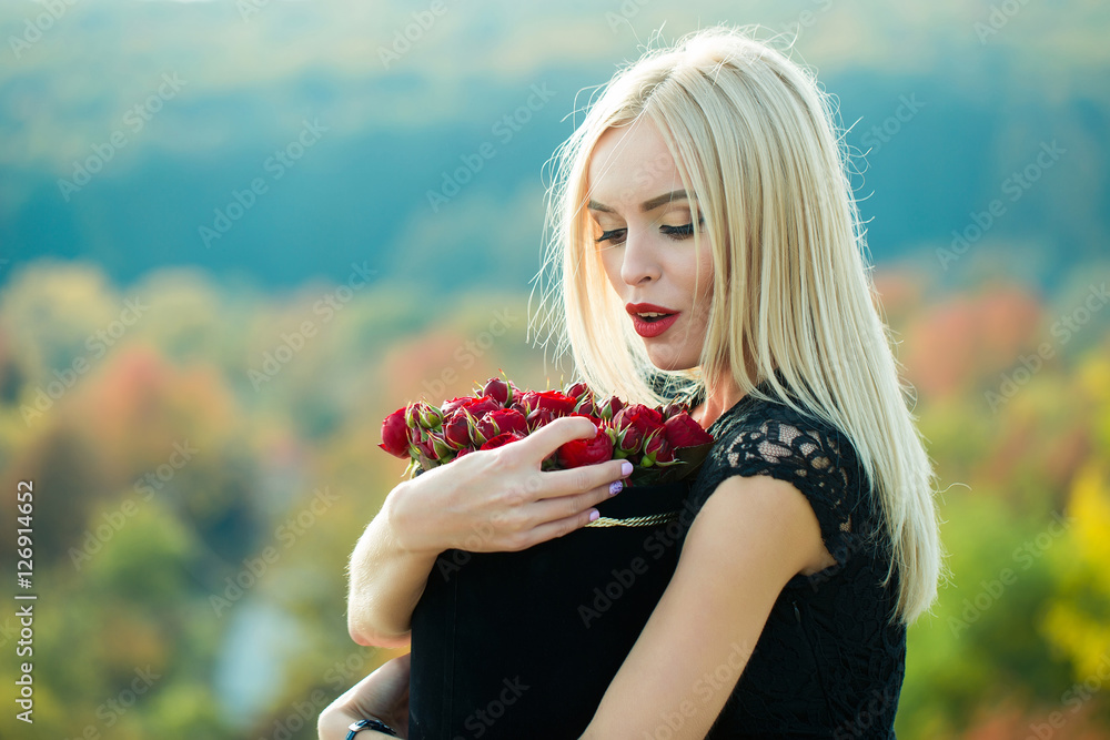 Pretty girl with flowers in box