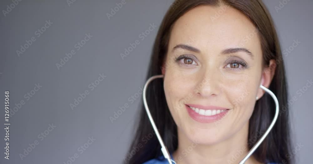 First person view of doctor using stethoscope with hand reaching in front toward camera First person view of doctor using stethoscope with hand reaching in front toward camera