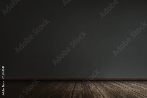 Black wall with grunge wooden plank floor
