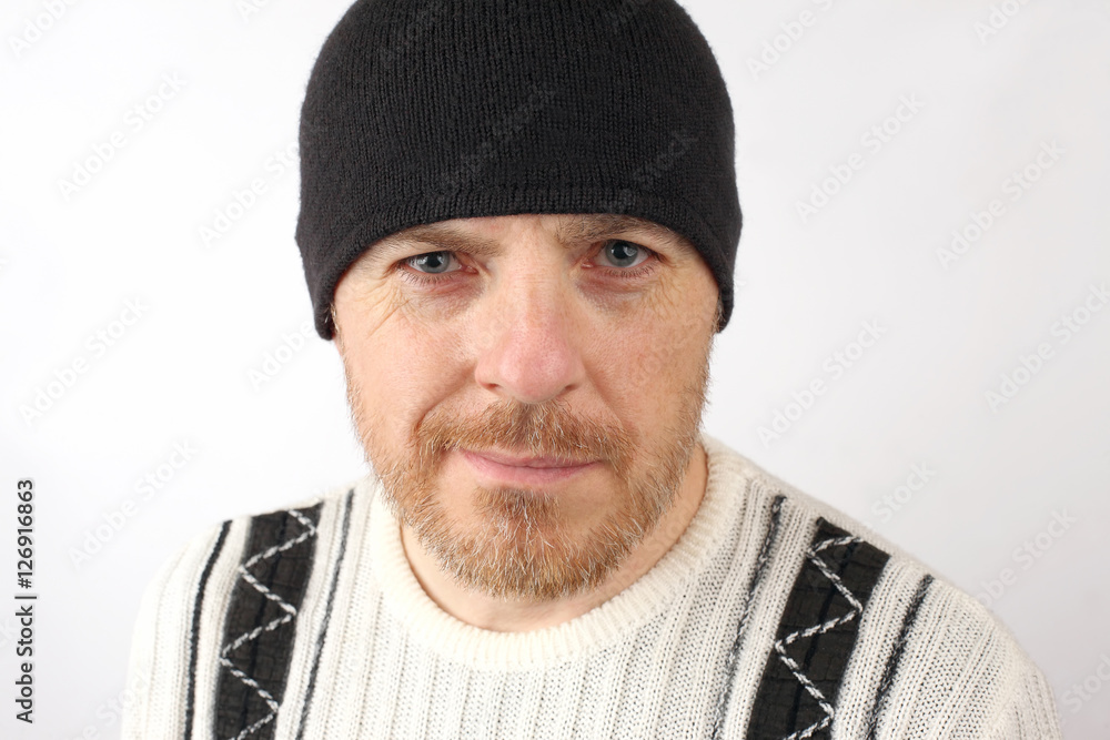portrait of unshaven man in a black hat portrait of unshaven man in a black hat