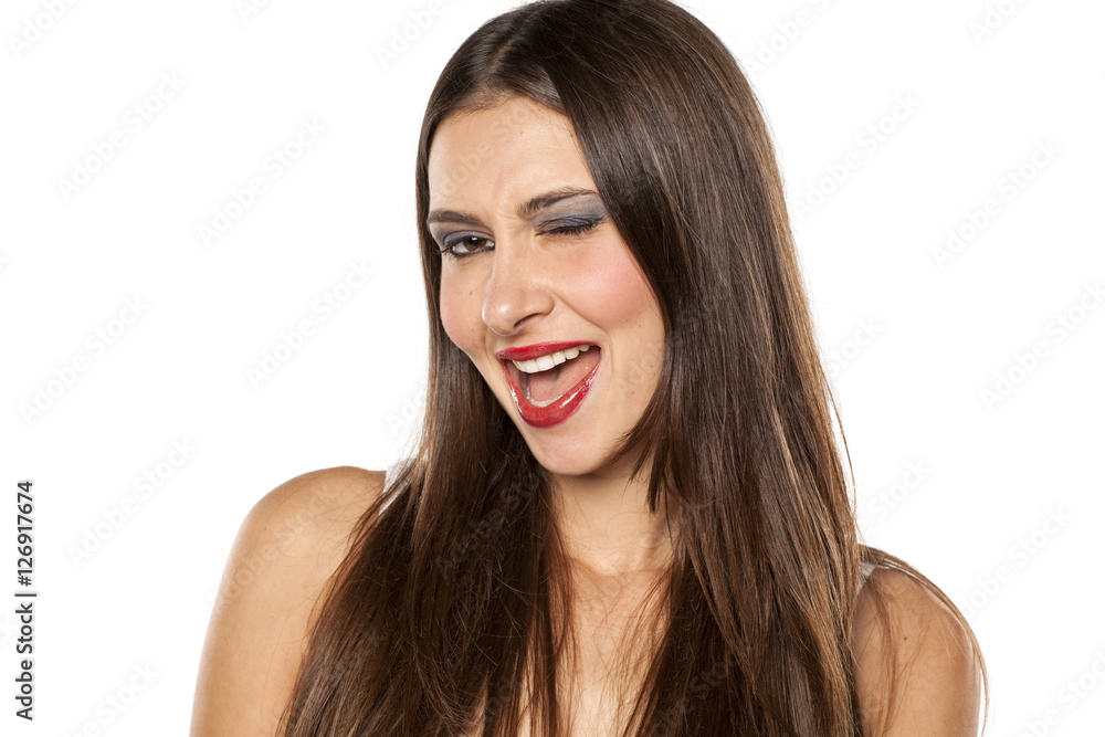 happy young woman winking happy young woman winking
