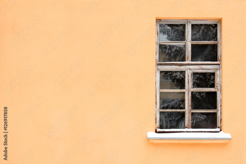 Orange wall with one old window