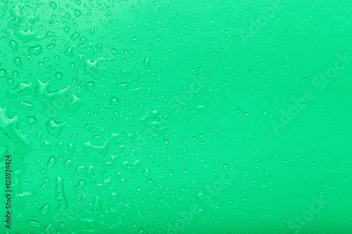 Drops of water on a color background. Green. Selective focus. Sh
