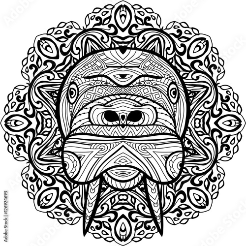 Element for your design. National ethnic circular pattern with the head of a walrus.