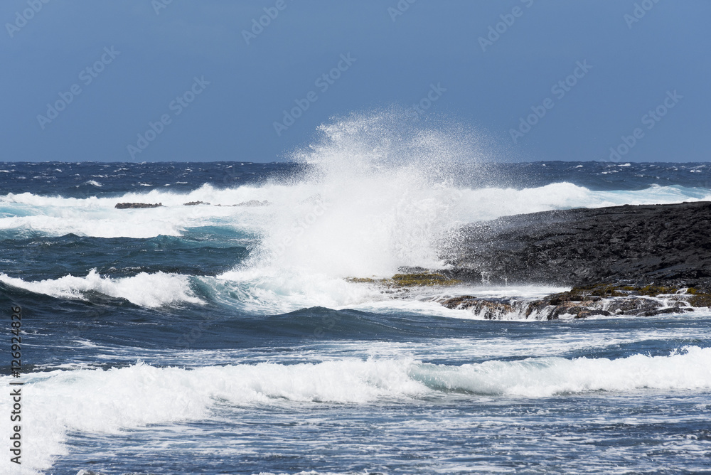 Lava coast and blue waters and white waves - Punalu'u Black Sand