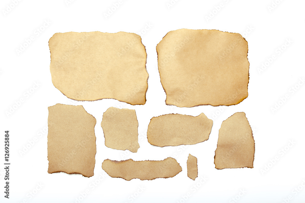 brown ripped pieces of paper on white background