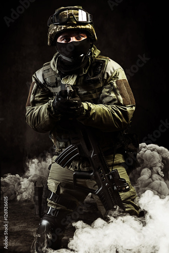 The man in the image of a member of the special forces with weap photo