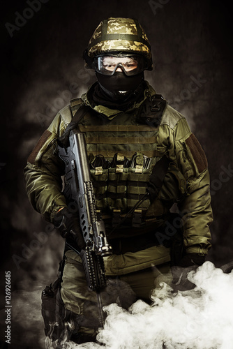 The man in the image of a member of the special forces with weap photo