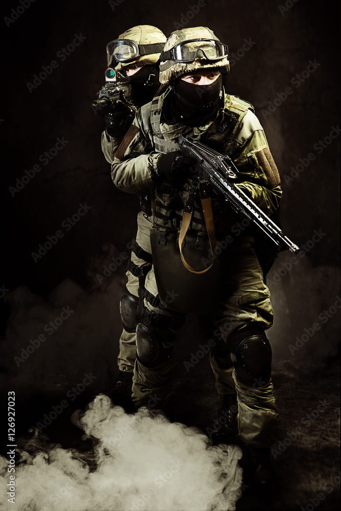 The men in the image of a member of the special forces with weap The men in the image of a member of the special forces with weap