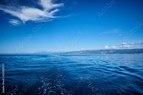Photo of Blue Sea and Tropical Sky Clouds.