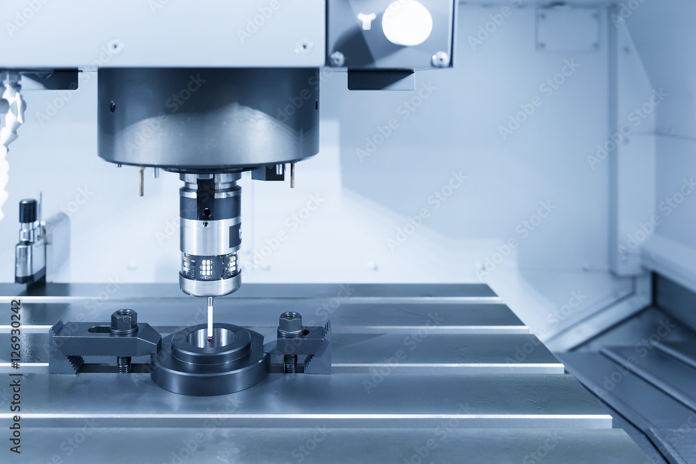 The probe for measurement the sample part on the CNC machine in silver-blue tone The probe for measurement the sample part on the CNC machine in silver-blue tone