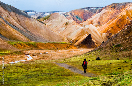 Hiker walking to Landmannalaugar mountains, Iceland photo