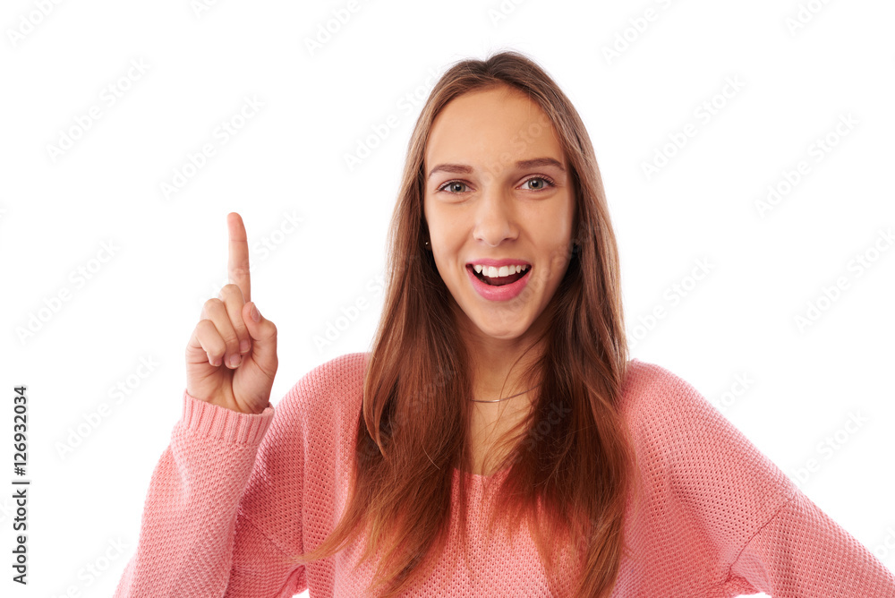Portrait of happy smiling girl pointing up finger to the copy sp Portrait of happy smiling girl pointing up finger to the copy sp
