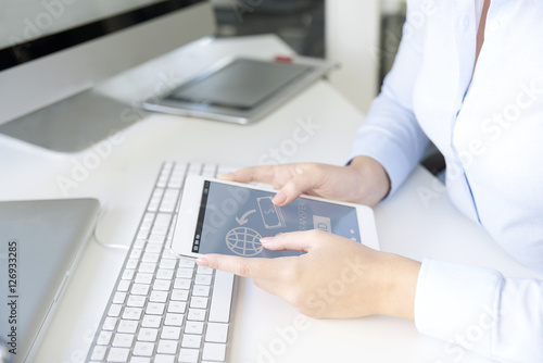 Woman using digital tablet. Close-up shop of a businesswoman using digital tablet while sign in the her bank account.