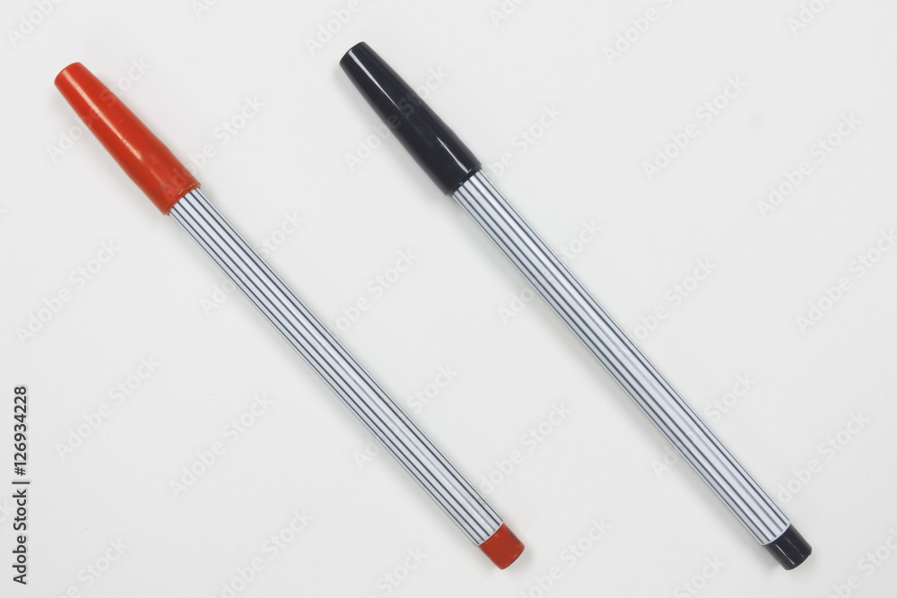 Black and red color pencil on white background. Black and red color pencil on white background.