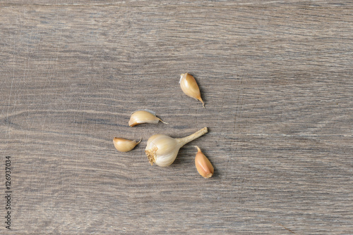 Garlic scattered on wooden table