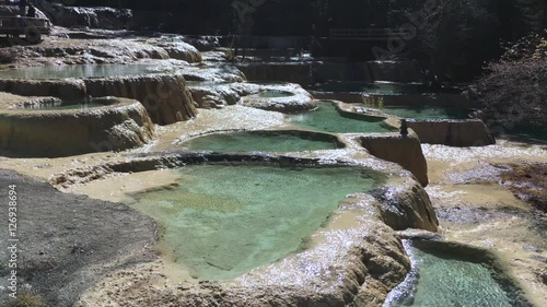 Huanglong Mountain with beautiful nature lime stone pond  ,waterfalls,lake  in Sichuan , China on sunny day