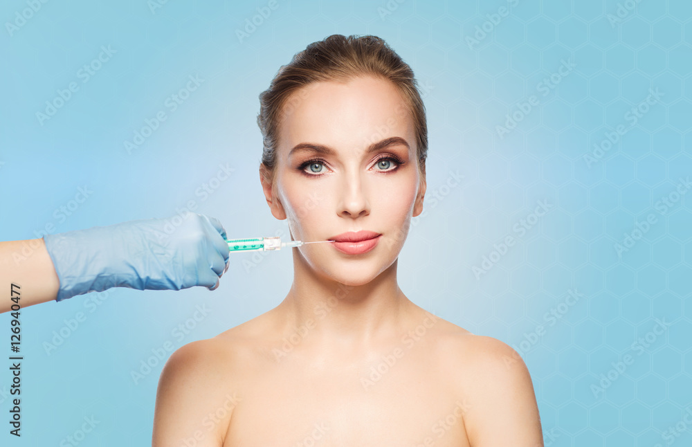 woman face and hand with syringe making injection woman face and hand with syringe making injection