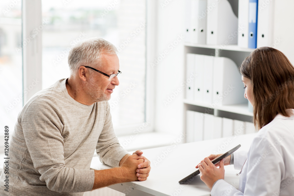 senior man and doctor with tablet pc at hospital senior man and doctor with tablet pc at hospital