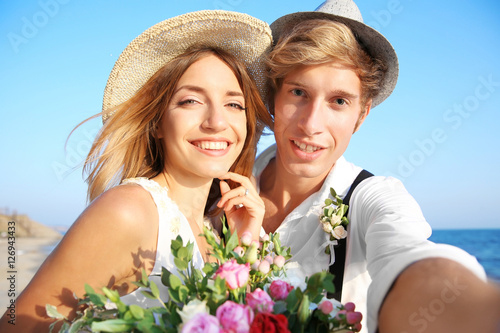 Young happy couple taking p...