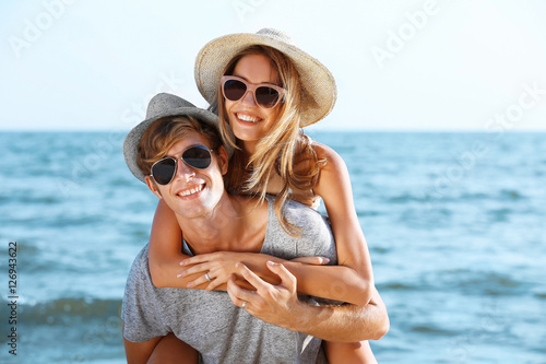 Happy couple on sea background