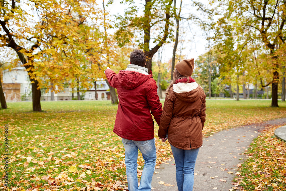 happy young couple walking in autumn park happy young couple walking in autumn park