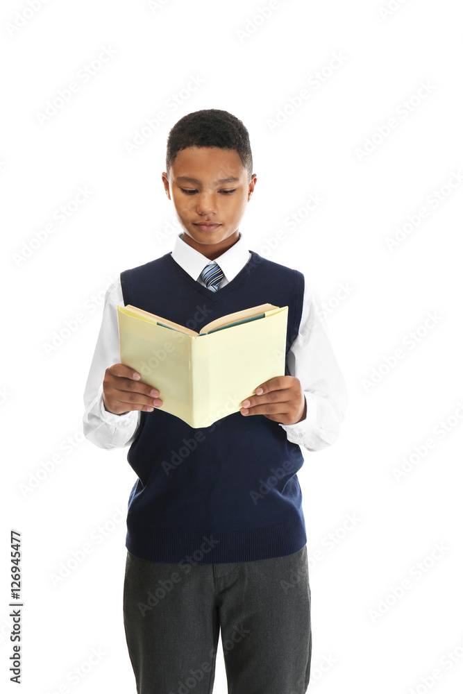 Cute teenager with book on white background