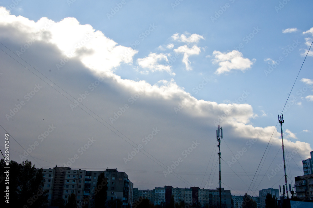 rainy cloud above houses with antenna