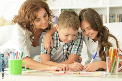 Mother with children drawing