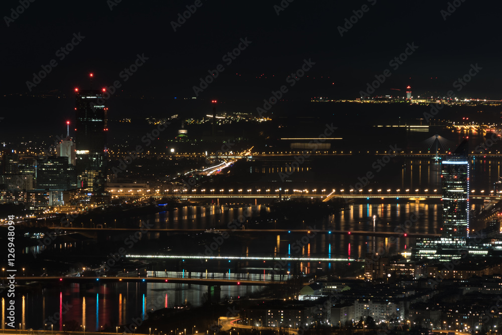 Vienna, aerial view at night with the river danube