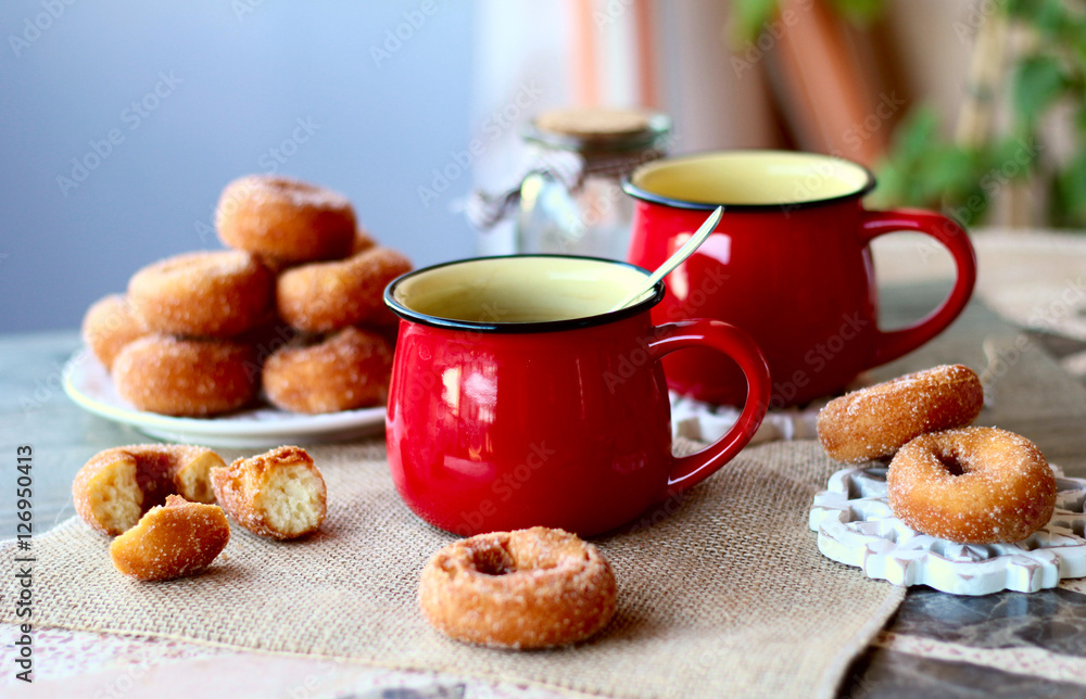 red cup tea wiht donuts