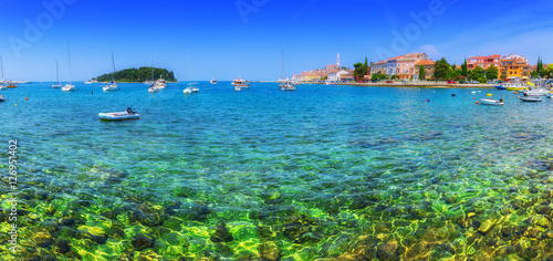 Wonderful romantic old town at Adriatic sea. Boats and yachts in harbor crystal clear turquoise water at magical summer. Rovinj. Istria. Croatia. Europe.