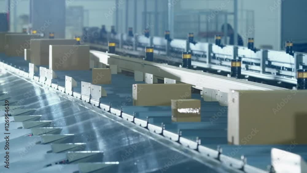 Parcels are Moving on Belt Conveyor at Post Sorting Office. Shot on RED Cinema Camera in 4K (UHD) Parcels are Moving on Belt Conveyor at Post Sorting Office. Shot on RED Cinema Camera in 4K (UHD)