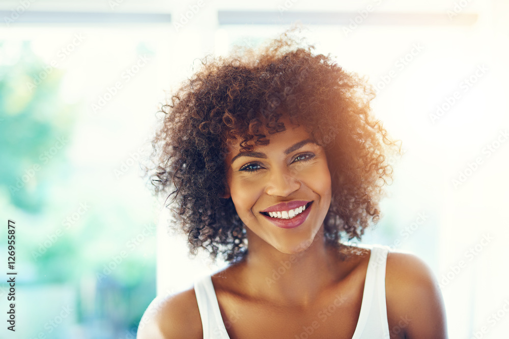 Attractive black girl smiling at camera Stock Photo | Adobe Stock