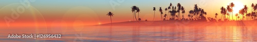 Panorama Sunset over a tropical island. Sunrise in the ocean. banner. 