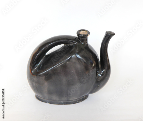 Clay black teapot isolated on white background