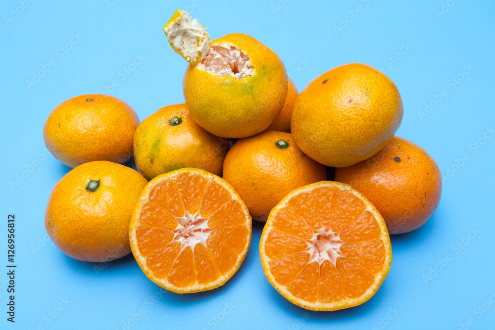 fresh and ripe oranges on blue backgrounds fresh and ripe oranges on blue backgrounds