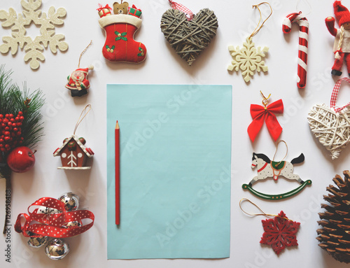 Flat lay of Christmas decoration ornaments on white background a