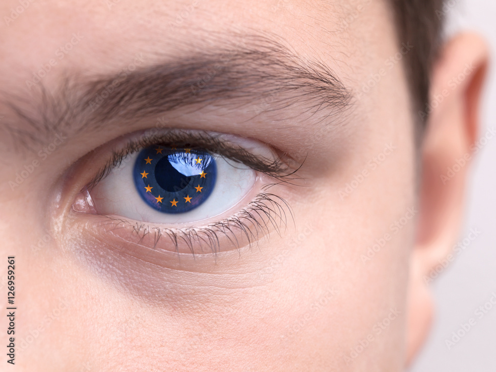 Obraz premium National flag of Brazil on a young boys iris