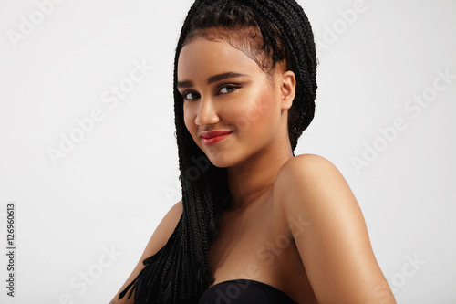 happy pretty smiling black woman with ideal skin wairs braids