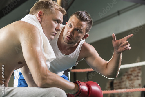  Trainer motivating boxer before fight