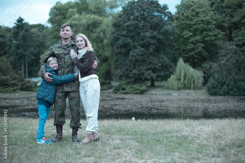 Soldier spending time with his wife and son © Photographee.eu