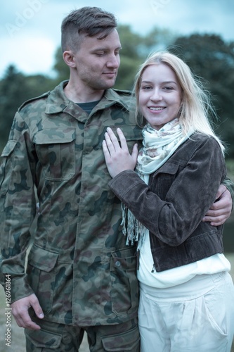 Soldier embracing his smiling wife