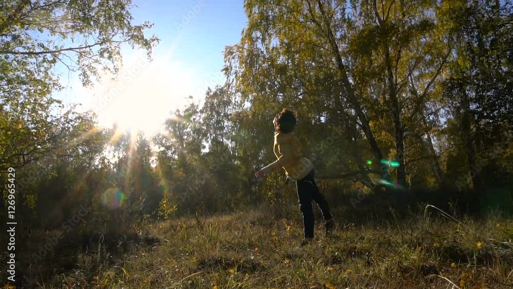Slow Motion Acrobatics Young Girl Autumn Forest on Sunny Day. Slow Motion Acrobatics Young Girl Autumn Forest on Sunny Day.