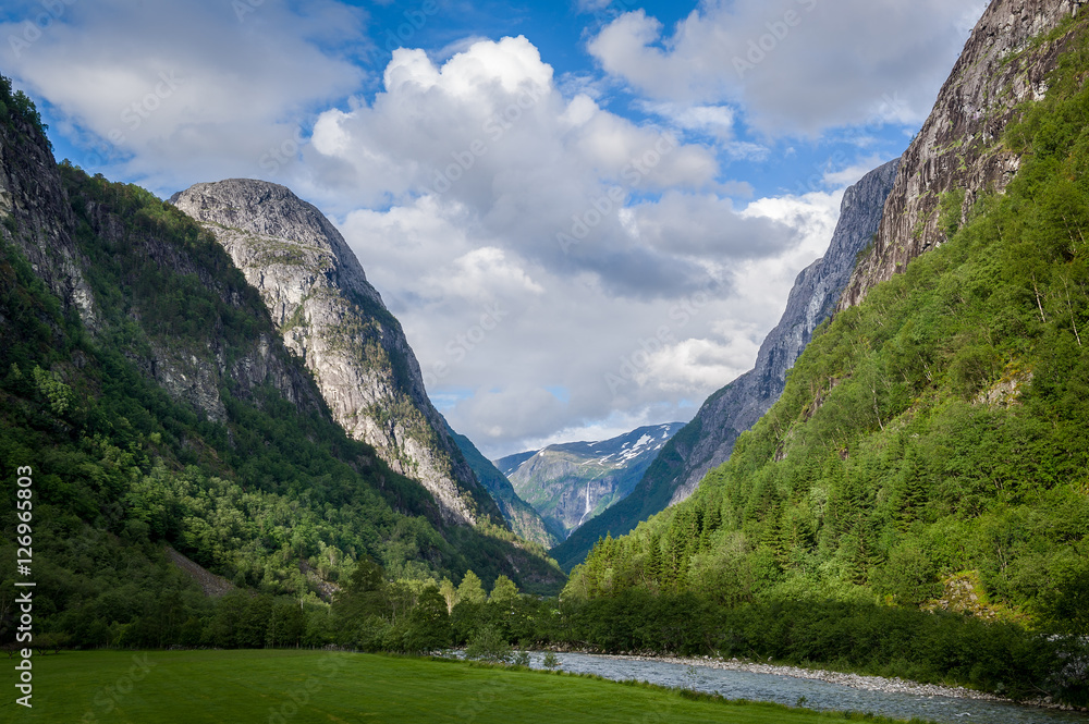 Scenic norway fjord mountains and river in canyon.