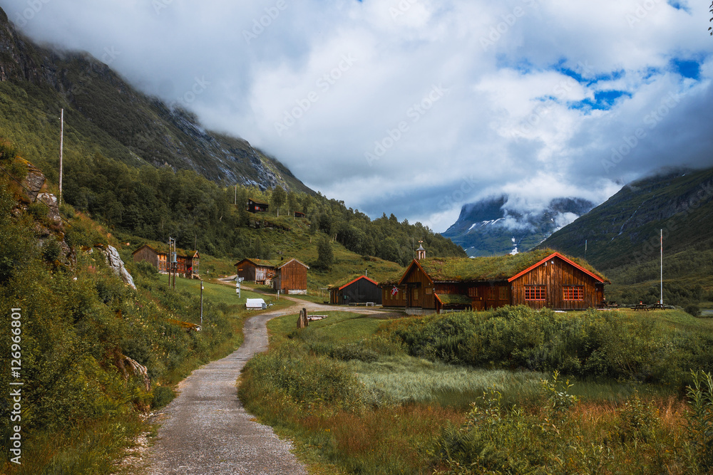 Small village of Innerdalen valley with clouds, Norway