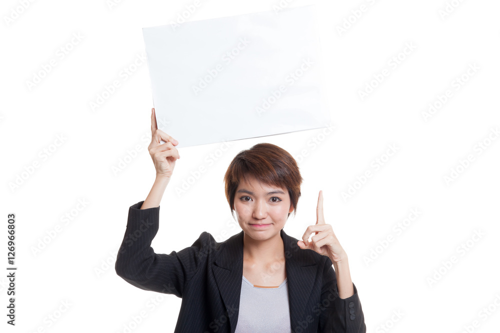 Young Asian business woman point to blank sign. Young Asian business woman point to blank sign.