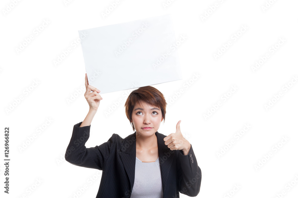 Young Asian business woman show thumbs up with white blank sign Young Asian business woman show thumbs up with white blank sign