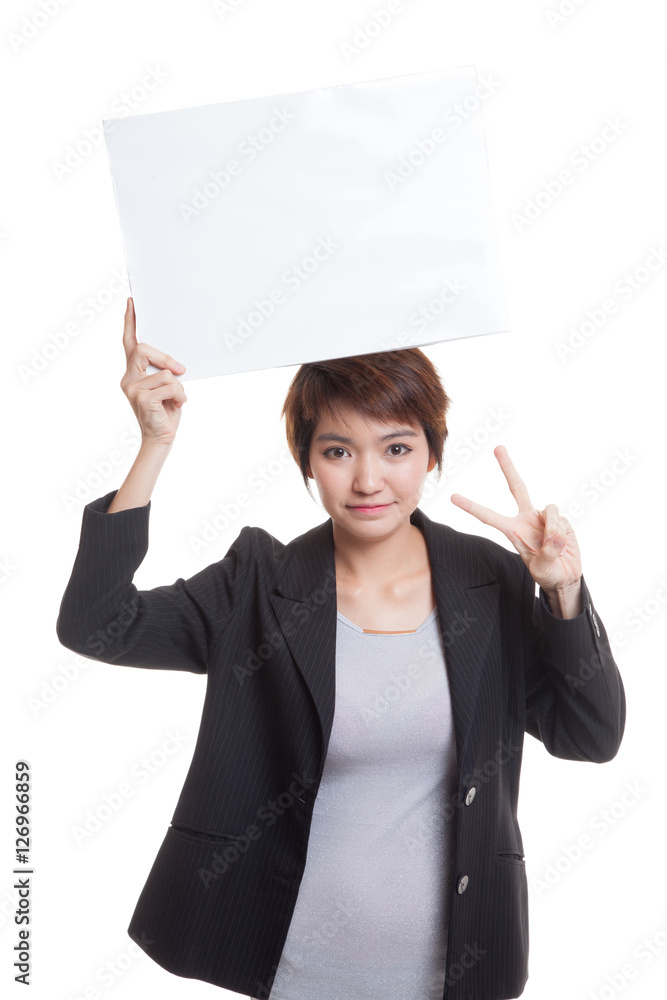 Young Asian business woman show victory sign with blank sign. Young Asian business woman show victory sign with blank sign.